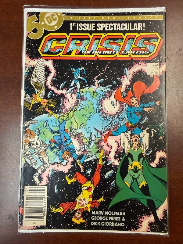 Crisis on Infinite Earths #1 (DC Comics, 1985), raw comic book in VF/NM condition — front cover