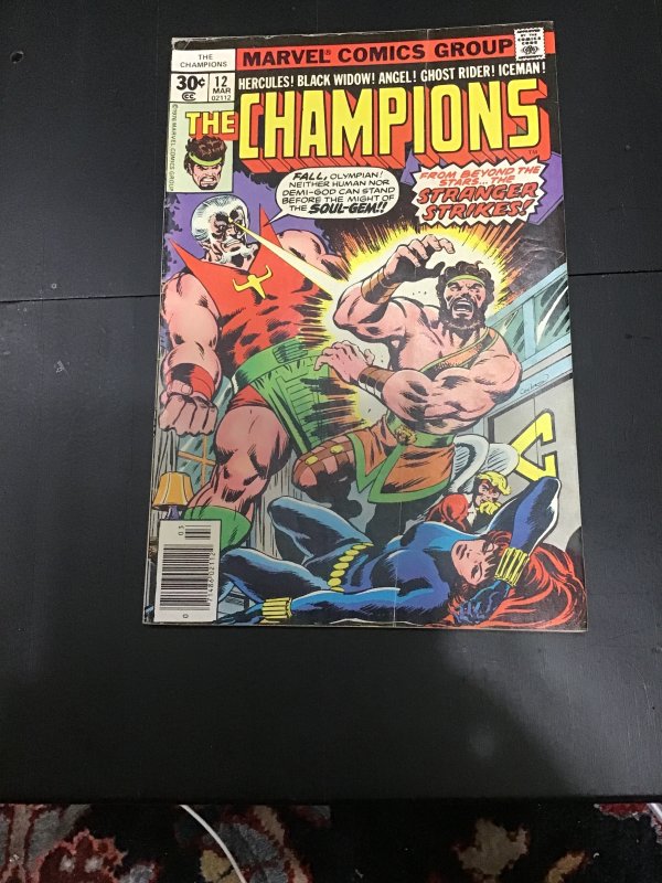 The Champions #12 (1977), raw comic book in VF/NM condition — front cover