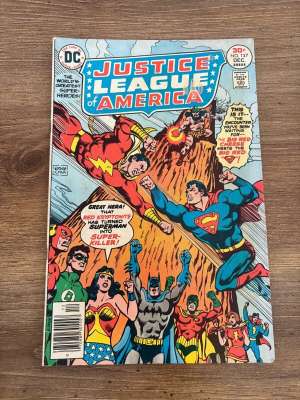 Justice League #137 (DC Comics), raw comic book in FN condition — front cover