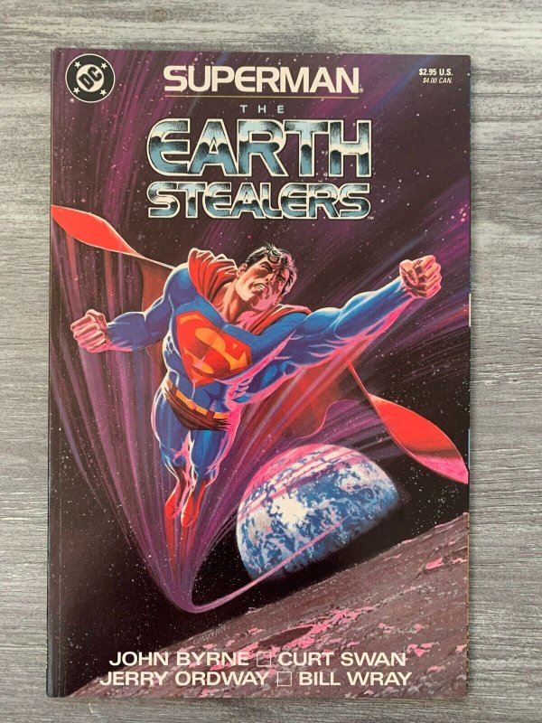 1988 Superman the Earth Stealers SC VF- 7.5 1st DC Comics / Swan Ordway Byrne (DC Comics, 1988), raw comic book in VF- 7.5 condition — front cover