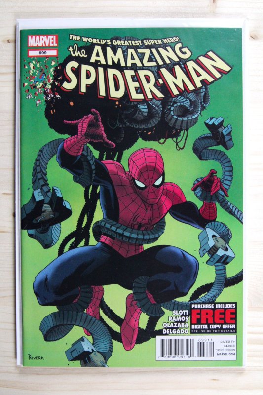 The Amazing Spider-Man #699 (Marvel Comics, 2013), raw comic book in NM 9.4 condition — front cover