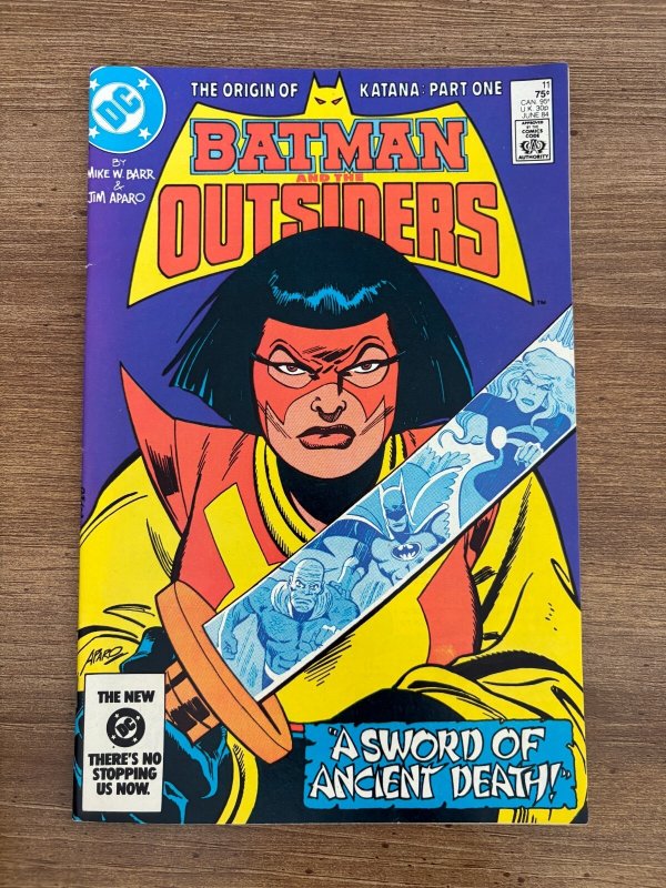 Batman & the Outsiders #11 (DC Comics), raw comic book in VF/NM condition — front cover