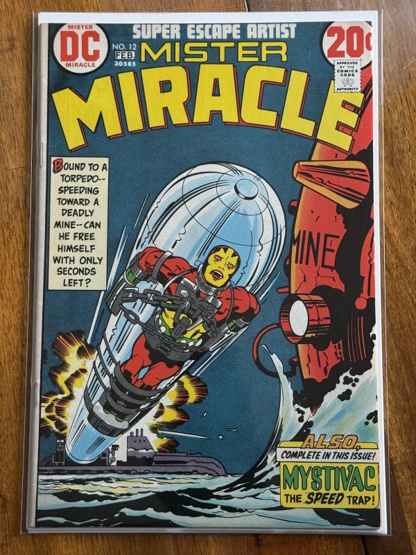 Mister Miracle #12 (DC Comics, 1973), raw comic book in FN/VF 7.0 condition — front cover