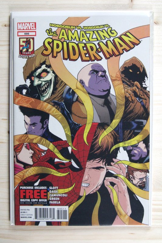 The Amazing Spider-Man #695 (Marvel Comics, 2012), raw comic book in NM 9.4 condition — front cover