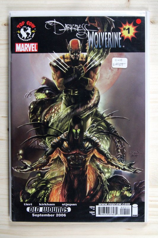 The Darkness/Wolverine #1 (Top Cow, 2006), raw comic book in NM- 9.2 condition — front cover