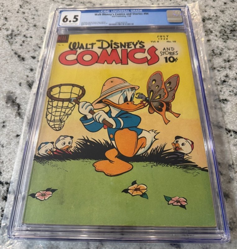 Walt Disney's Comics & Stories #94 (1948), CGC 6.5 graded comic book, Universal Blue label — front cover in its holder