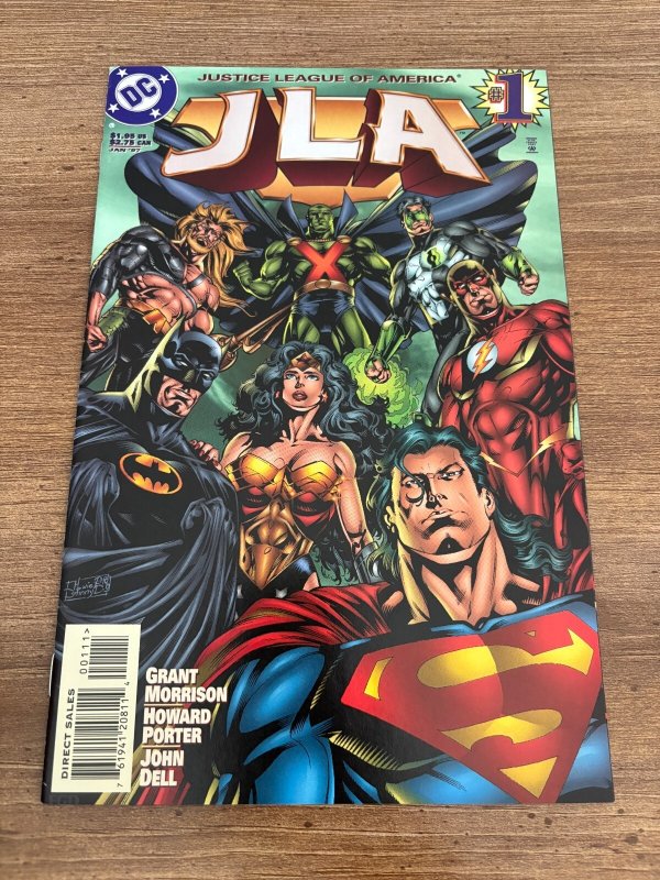 JLA #1 (DC Comics, 1997), raw comic book in NM condition — front cover