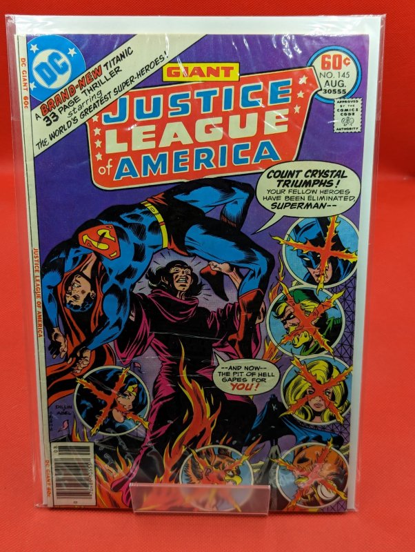 Justice League of America #145 (DC Comics, 1977), raw, ungraded comic book — front cover