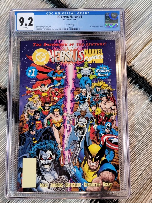 DC Versus Marvel #1 (1996), CGC 9.2 graded comic book, Universal Blue label — front cover in its holder